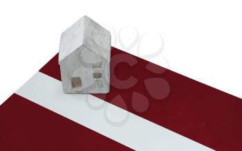 Small house on a flag - Living or migrating to Latvia