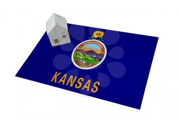 Small house on a flag - Living or migrating to Kansas