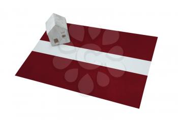 Small house on a flag - Living or migrating to Latvia