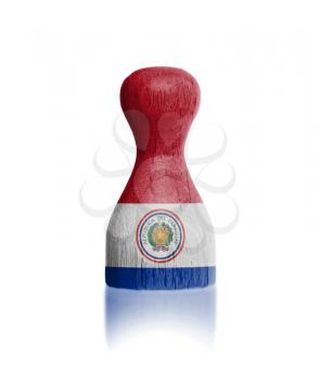 Wooden pawn with a painting of a flag, Paraguay