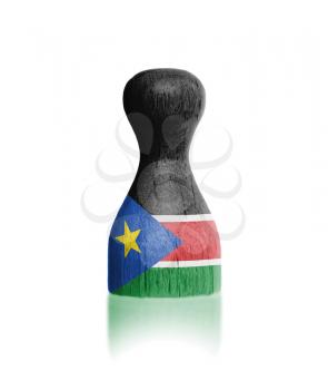 Wooden pawn with a painting of a flag, South Sudan