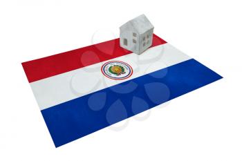 Small house on a flag - Living or migrating to Paraguay