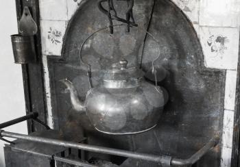 Simple teapot in a kitchen in a vintage house