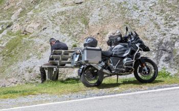 Unrecognisable motorcycle and driver in the Alps - Enjoying the scenery