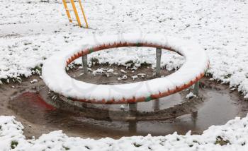 Playground in kindergarten for children in winter with snow