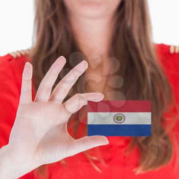 Businesswoman showing a business card - Paraguay