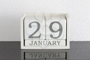 White block calendar present date 29 and month January on white wall background