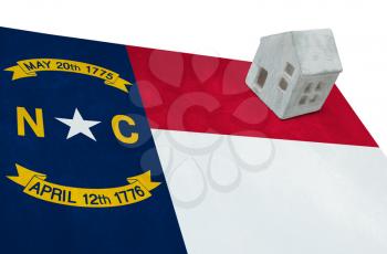 Small house on a flag - Living or migrating to North Carolina