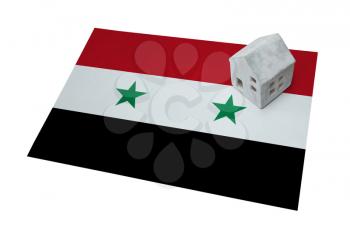 Small house on a flag - Living or migrating to Syria