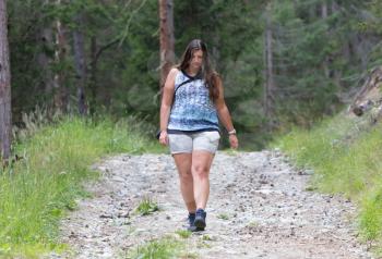 Hiker, young woman walking on footpath, Austria