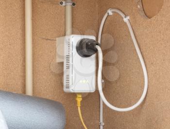 Powerline network adaper plugged into a wall socket - The Netherlands