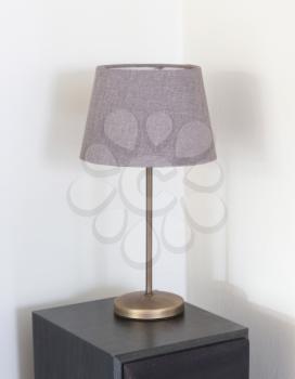 Table lamp standing on a large speaker - Light is not on
