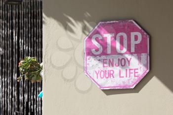 Old stop sign - Enjoy your life - Concept