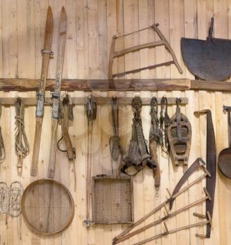Old tools and vintage items hanging in an Austrian barn