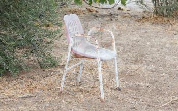 Empty chair in a park in Greece