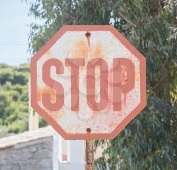 Old stop sign in a village in Greece