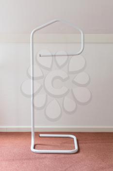 Small coat rack standing in a room
