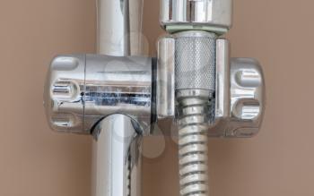 Closeup of a tap in a shower - Selective focus