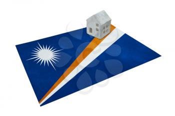 Small house on a flag - Living or migrating to Marshall Islands