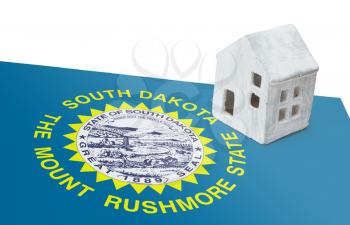 Small house on a flag - Living or migrating to South Dakota