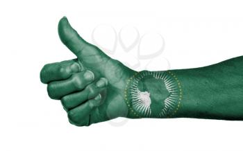 Old woman with arthritis giving the thumbs up sign, isolated on white - African Union