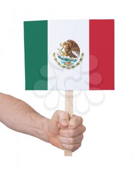 Hand holding small card, isolated on white - Flag of Mexico