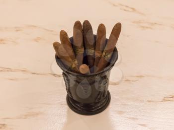 Collection of different cigars in a cup - Selective focus