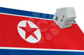 Small house on a flag - Living or migrating to North Korea