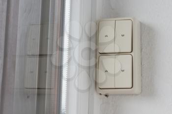 Button for electric shutters in an old apartment