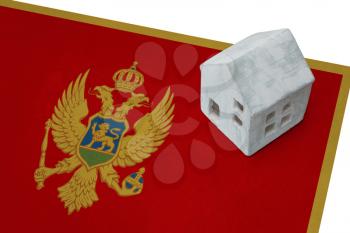 Small house on a flag - Living or migrating to Montenegro