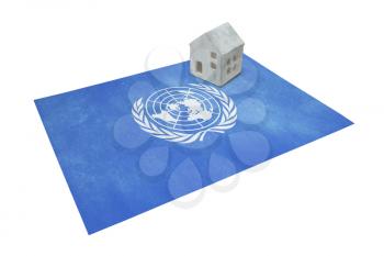 Small house on a flag - Living or migrating to the UN
