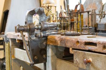 Old heavy duty bench vise in a workshop