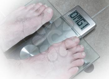 Closeup of man's feet on weight scale - OMG