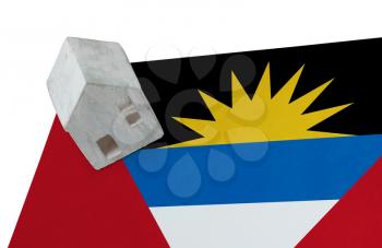 Small house on a flag - Living or migrating to Antigua and Barbuda