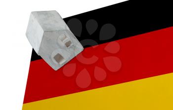 Small house on a flag - Living or migrating to Germany