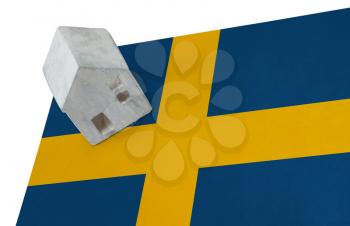 Small house on a flag - Living or migrating to Sweden