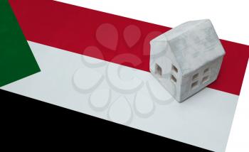 Small house on a flag - Living or migrating to Sudan