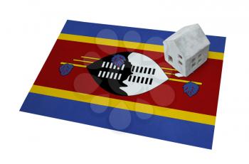 Small house on a flag - Living or migrating to Swaziland