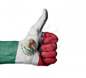 Closeup of male hand showing thumbs up sign, flag of Mexico