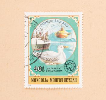 MONGOLIA - CIRCA 1980: A stamp printed in Mongolia shows a submarine, boat and a bird, circa 1980