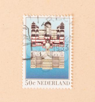 THE NETHERLANDS 1983: A stamp printed in the Netherlands shows a building, circa 1983