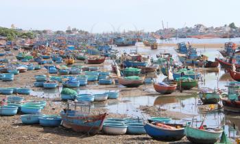 Colorful fishing boats on the beach in southern Vietnam