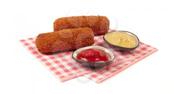Brown crusty dutch kroket with sauces (mustard and ketchup) isolated on a white background