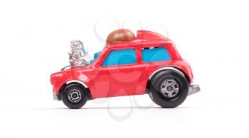 Red metal toy car, isolated on white