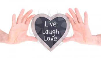 Adult holding heart shaped chalkboard - Isolated on white - Live laugh love