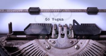 Go Vegan, written on an old typewriter, vintage