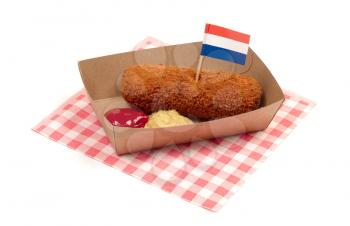 Brown crusty dutch kroket with mustard and ketchup isolated on a white background