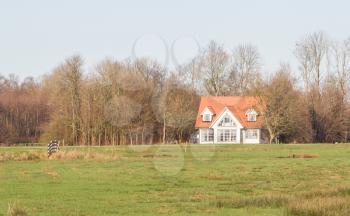 Old dutch house in the typical dutch wet landscape