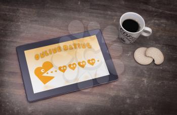 Online dating on a tablet - concept of love, yellow
