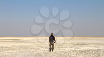 Unrecognisable photographer staring at the plains of the Makgadikgadi, Botswana
